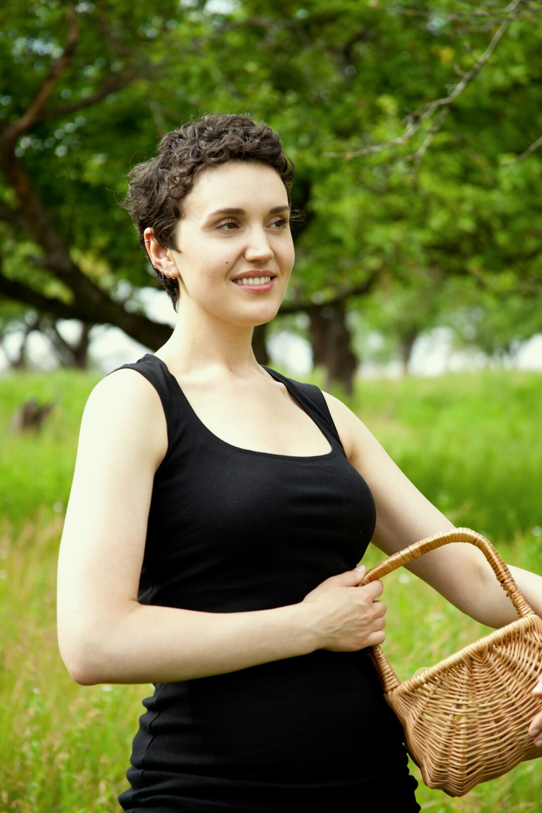 Portrait of a smiling woman with shoulder-length brown hair